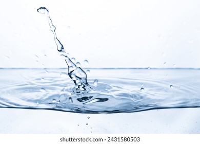 Drops bouncing off clean, clear water, creating a splash effect and an interesting shape