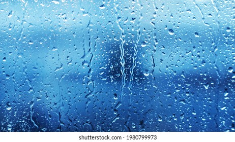  Drops Of Heavy Rainfall On The Clear Transparent Glass Of The Window In Cloudy Weather During The Day. Sadness And Melancholy. Dampness. Bad Weather.