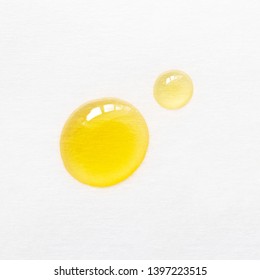 Drops Of Oil Essence For Face Care On White Background