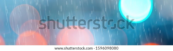 drops on\
glass auto road rain autumn night / abstract autumn background in\
the city, auto traffic, romantic trip by\
car