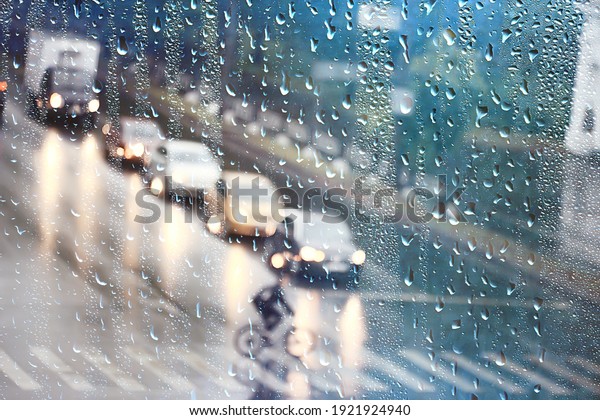 drops on\
glass auto road rain autumn night  abstract autumn background in\
the city, auto traffic, romantic trip by\
car