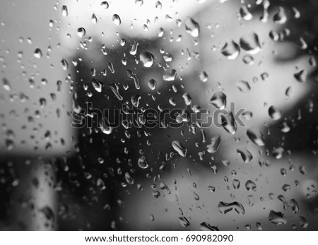 Drops on a glass surface and steam/Water drop on glass mirror background