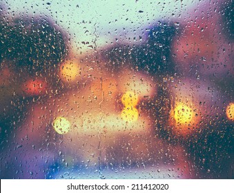 Drops Of Rain On Blue Glass Background. Street  Bokeh Lights Out Of Focus. Autumn Abstract Backdrop - Shutterstock ID 211412020