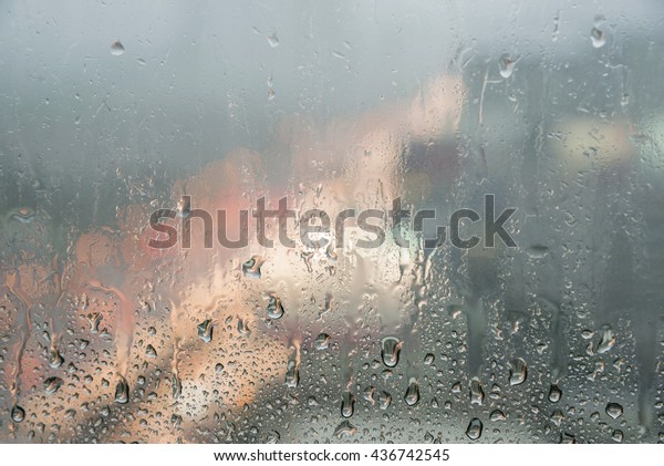 Drops of rain on dirty\
glass background