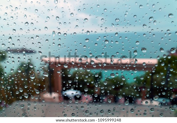 Drops of rain on the window on the
background of the sea, Budva, Montenegro 
1