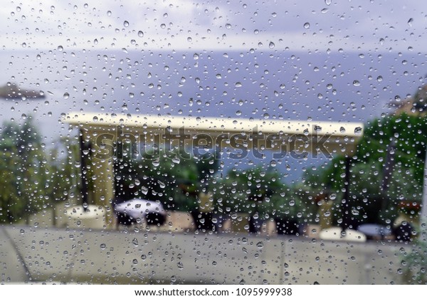 Drops of rain on\
the window on the background of the sea, Budva, Montenegro  2      \
                  
