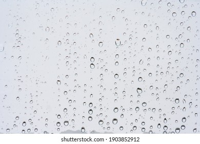 Drops Of Rain On The Window Or Glass. Gray Wet Glass Pattern Texture. Abstract Backgrounds