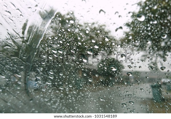 Drops of rain on the window, rainy day, dark\
tone. Shallow DOF\
\

