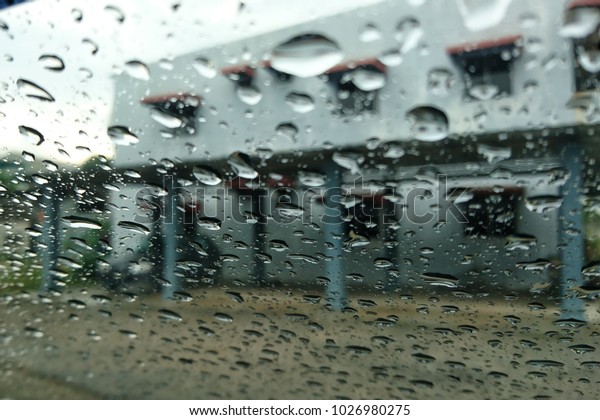 The
drops of rain on the windows car on a rainy
day

