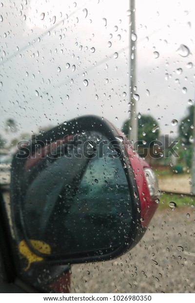 The
drops of rain on the windows car on a rainy day 
