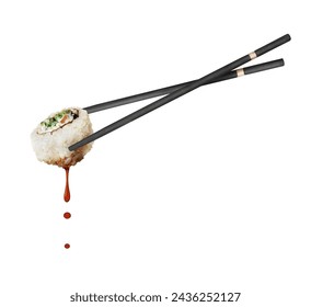 Drops of soy sauce dripping from a sushi roll sandwiched between two chopsticks on a white background - Powered by Shutterstock
