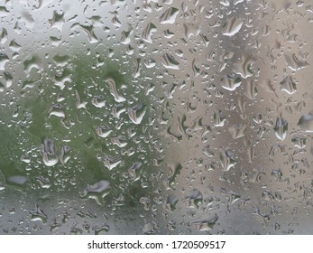 drops of spring rain on the apartment window