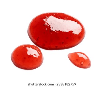 Drops of sweet strawberry jam on white background