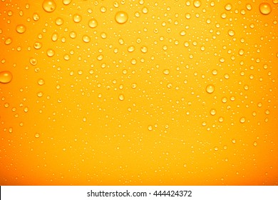 Drops Of Water On A Color Background. Orange. Toned.