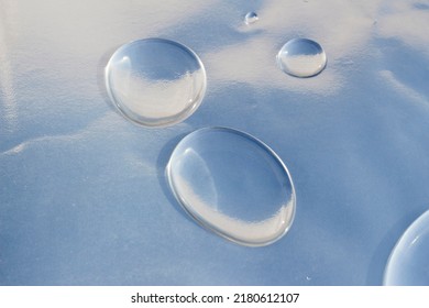 Drops Of Water On Metallic Waterproof Paper. Liquid Texture Wallpaper.