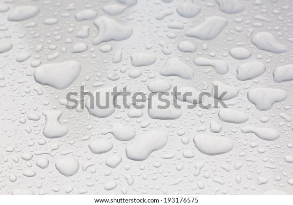 Drops of water\
on a rainy day on the car\
surface