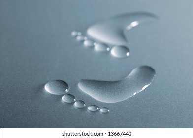 Drops Of Water That Look Like Bare Footprint