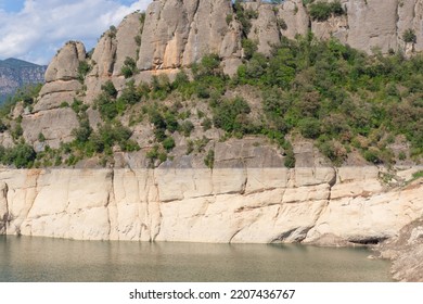 The Drought In Catalonia Of A Swamp On The Wall Of The Mountain With The Line Where The Water Level Reached Before