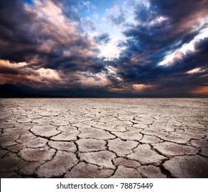 Drought Earth And Storm Dramatic Sky At Background