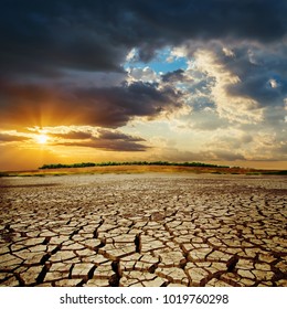 Drought Earth In Sunset. Dramatic Sky Over Desert. Change Climat