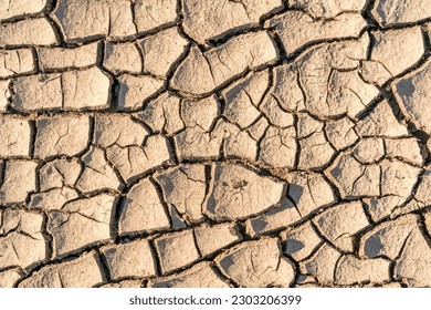 Drought, the ground cracks, no hot water, lack of moisture. Dried and Cracked ground.Cracked surface.Dry soil in arid areas.