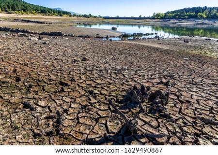 Drought at La Jarosa reservoir in summer time. Sierra de Guadarrama. Madrid. Spain. Europe.