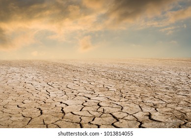 Drought land against a sunset sky with clouds. - Powered by Shutterstock