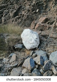 Drought-resistant wild vegetation grows among bone dry stones and rocks in the barren Hajar Mountains range that straddles the United Arab Emirates and the Sultanate of Oman.