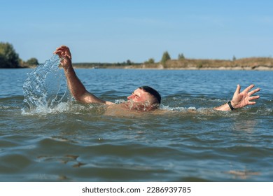 Drowning man in the river needs help.