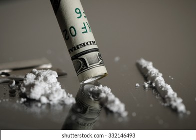 Drug Abuse Macro of White Powder Cocaine and Rolled Up Bill