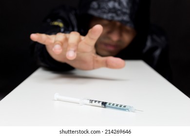 Drug Addict Craving Drugs, Syringe On Table