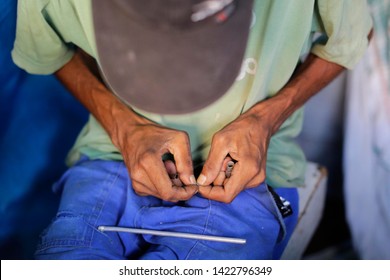 A Drug Addict Prepares To Smoke Crack Cocaine Inside A Shack In An Area Popularly Known As Crackland In Downtown Sao Paulo, Brazil.