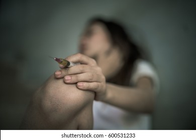 Drug Addict Young Woman With Syringe In Action, Drug Abuse Concept. 