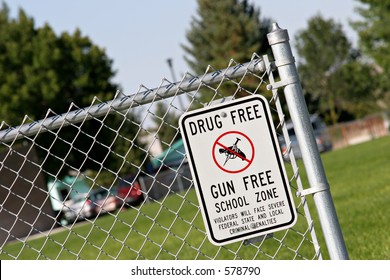 Drug And Gun Free School Zone Sign At A School Yard. Sign Of The Times.