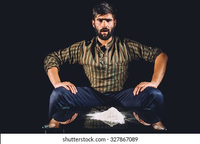 Drug Lord With A Big Pile Of Cocaine On His Table. Illegal Activity.