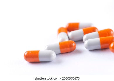 Drug prescription for treatment medication. Pharmaceutical medicament,  Pharmacy theme, Heap of orange white medicament - Shutterstock ID 2050570673