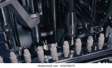 Drug Production. Medical Vials On Pharmaceutical Manufacturing Line. Medical Ampoules On Automated Production Line At Factory. Process Of Production Of Pills, Tablets. Pharmaceutical Industry.