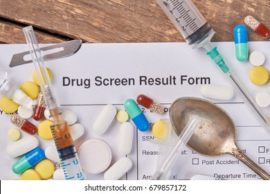 Drug screen result form, syringes, spoon. Result of drugs overdose.