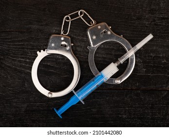 Drug Syringe And Handcuffs, Arrest Drug Dealer.