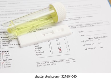 Drug test blank form with test kit and urine,focus on paper