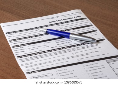 Drug Test Results Form And Pen Blue Color On The Table.