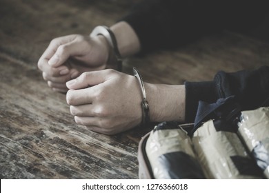 Drug Traffickers Were Arrested Along With Their Heroin. Police Arrest Drug Trafficker With Handcuffs. Law And Police Concept,World Anti-Drug Day, 26 June, International Day Against Drug Abuse.