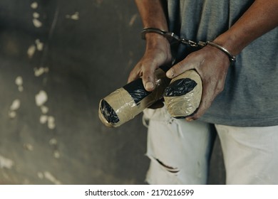 Drug Traffickers Were Arrested Along With Their Heroin. Police Arrest Drug Trafficker With Handcuffs. Law And Police Concept,26 June, International Day Against Drug Abuse And Illicit Trafficking