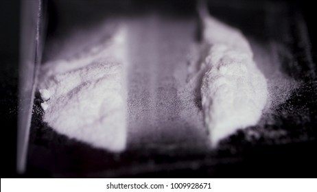 Drug Use, People, Addiction And Substance Abuse Concept - Close Up Of Addict Hands With Crack Cocaine Drug Dose Track On Mirror And Credit Card. The Addict Uses Drugs, Using A Credit Card.