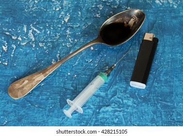 Drugs Abuse And Addiction Concept. Lighter, Syringe Spoon  With Morphine (opiate)