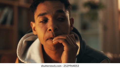 Drugs, addiction and man biting nails with stress, fear or withdrawal symptom in home at night. Nervous, thinking and person in crisis in dark apartment with anxiety, substance abuse or opioid detox - Powered by Shutterstock