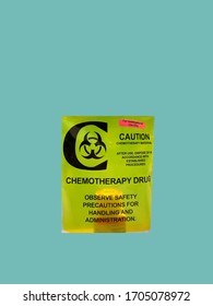 Drugs For Chemotherapy Are Delivered In A Plastic Protective Bag That Reads Hazardous Material Handle With Caution.