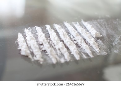 Drugs Ready For Snorting On Glass Table. Substance Addiction And Social Issues Concept