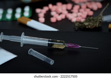 drugs in a syringe, Pills and narcotics are dangerous to health or brain nervous system - Shutterstock ID 2222517505