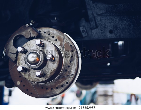 Drum brake mechanism of car wheel in garage. with\
copy space.